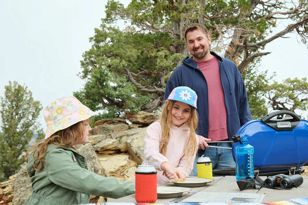 Family picnic setup near Plug Hat Butte in Dinosaur National Monument