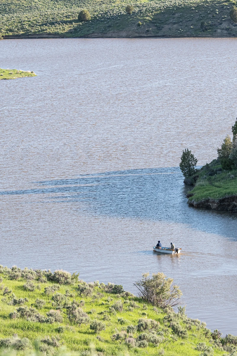 Small motorboat in a quiet cove on Elkhead Reservoir, Colorado